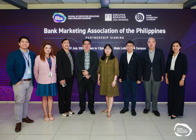 Bank Marketing Association of the Philippines executives pose with AIM faculty and staff.